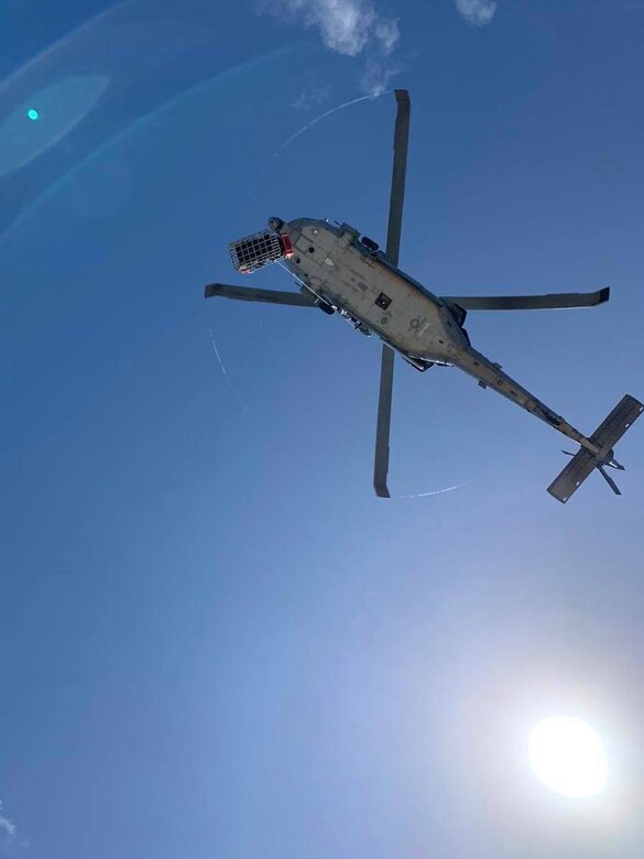 PACIFIC OCEAN (Nov. 20, 2019) A Chinese national in medical distress rescued aboard the Chinese-flagged vessel Jin Bo is secured in the rescue basket and hoisted to an MH-60S Sea Hawk helicopter during a medical evacuation mission conducted by the "Island Knights" of Helicopter Sea Combat Squadron (HSC) 25.  The patient received life-saving medical care by the HSC-25 flight surgeon and medical team while being transported approximately 100 miles to Guam Memorial Hospital for treatment. HSC-25 provides a multi-mission rotary wing capability for units in the U.S. 7th Fleet area of operations and maintains a Guam-based 24-hour search-and-rescue and medical evacuation capability, directly supporting U.S. Coast Guard and Joint Region Marianas. HSC-25 is the Navy’s only forward-deployed MH-60S expeditionary squadron.