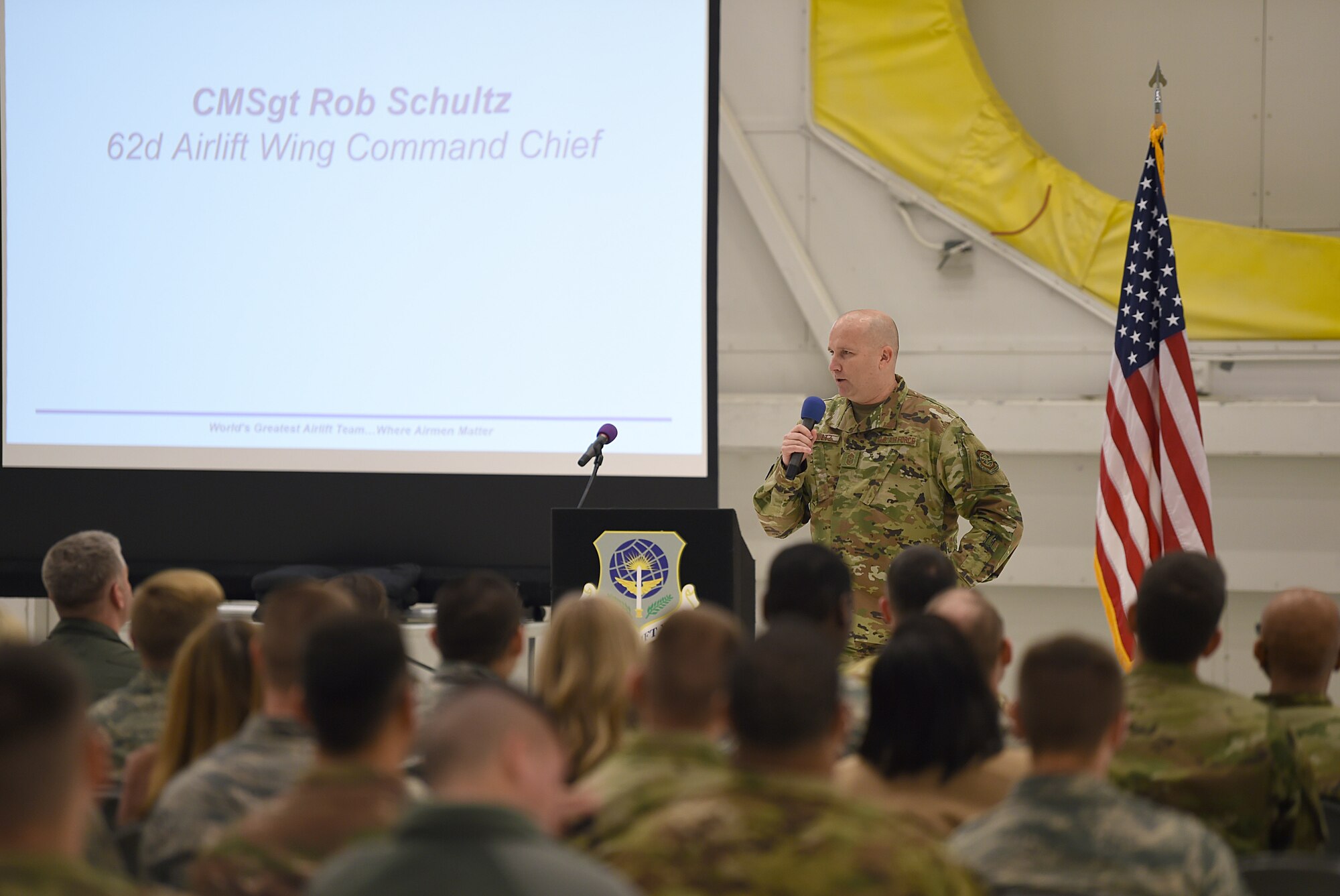 Chief Master Sgt. Rob Schultz, 62nd Airlift Wing command chief, address members of the 62nd Airlift Wing during an all-call on Joint Base Lewis-McChord, Wash., Nov. 15, 2019. This was the first time since filling the position of command chief that he publicly addressed the wing en masse.