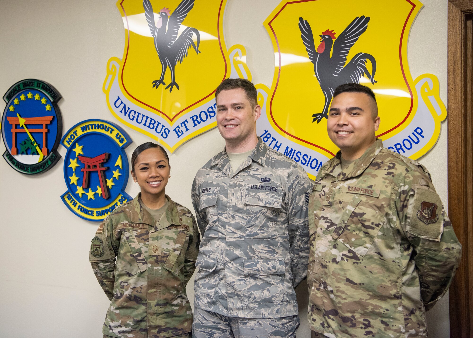 From left, Master Sgt. Joy McCammon, 718th Force Support Squadron casualty operations section chief, Staff Sgt. Alexander Nestle, 18th Communications Squadron software development supervisor, and Tech. Sgt. Christopher Sills, 18th CS NCO in charge of application development, stand for a photo at Kadena Air Base, Japan, Nov. 19, 2019. They are part of the PRAS team named as one of two U.S. Pacific Air Forces Spark Tank nominees to compete at the Air Force level. (U.S. Air Force Photo by Airman 1st Class Mandy Foster)