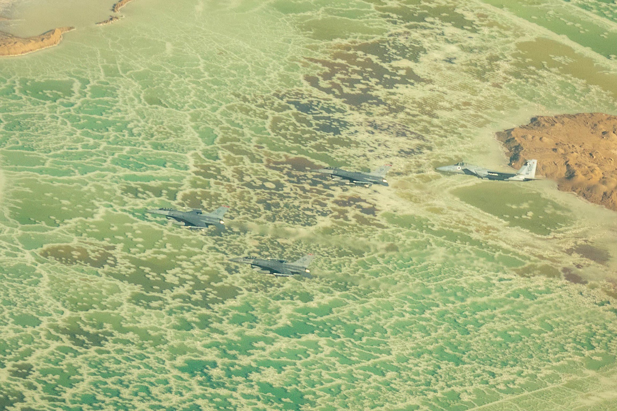 Three U.S. Air Force F-16 Fighting Falcons, assigned the to 480th Expeditionary Fighter Squadron, fly with an Israeli air force F-15I Ra'am over the Dead Sea, during exercise Blue Flag 2019 at Uvda Air Base, Israel, November 5, 2019. Blue Flag 2019 provided Airmen with the opportunity to practice low-altitude flying. (Courtesy photo by Israeli air force public affairs)