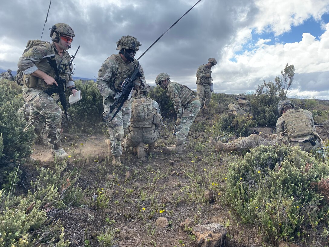 Staff Sgt. Ryan Dillman, 25th Air Support Operations Squadron Tactical Air Control Party, maneuvers toward the assaulting platoon with Alpha Company while coordinating a Medical Evacuation nine-line for a notional casualty while Observer Controllers/Trainers stand by during a Fire Support Coordination Exercise on Pohakuloa Training Area, located on the big island of Hawaii, November 12 through 21, 2019. During the exercise, members of the 25th ASOS and U.S. Army Pacific 2nd Brigade, 25th Infantry Division, 2nd Brigade Combat Team, integrated with B-52 Stratofortress bombers for live-fire training missions in support of Indo-Pacific Command’s Continuous Bomber Presence operations. (Courtesy photo)