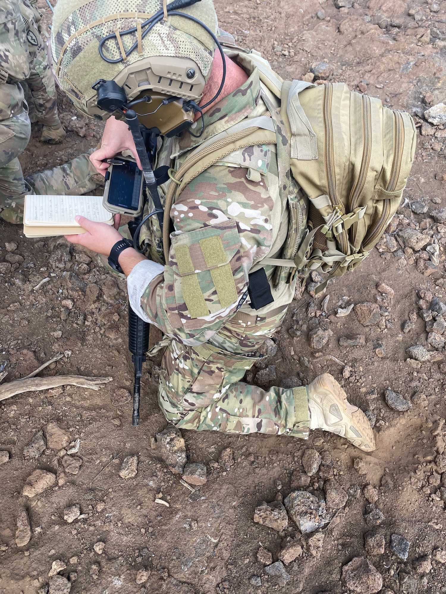 Staff Sgt. Ryan Dillman, 25th Air Support Operations Squadron Tactical Air Control Party, plots updated friendly positions before passing targeting and providing terminal guidance to an armed AH-64 Apache during a Fire Support Coordination Exercise on Pohakuloa Training Area, located on the big island of Hawaii, November 12 through 21, 2019. During the exercise, members of the 25th ASOS and U.S. Army Pacific 2nd Brigade, 25th Infantry Division, 2nd Brigade Combat Team, integrated with B-52 Stratofortress bombers for live-fire training missions in support of Indo-Pacific Command’s Continuous Bomber Presence operations. (Courtesy photo)