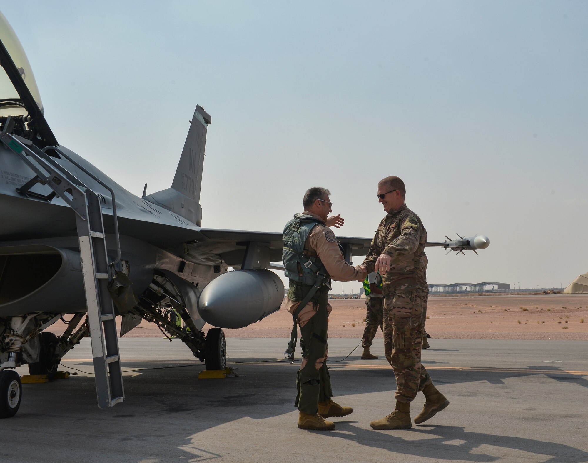 U.S. Air Force Lt. Gen. Joesph Guastella, left, U.S. Air Forces Central Command commander, greets U.S. Air Force Brig. Gen. John Walker, 378th Air Expeditionary Wing commander, at Prince Sultan Air Base, Kingdom of Saudi Arabia, Nov. 11, 2019.