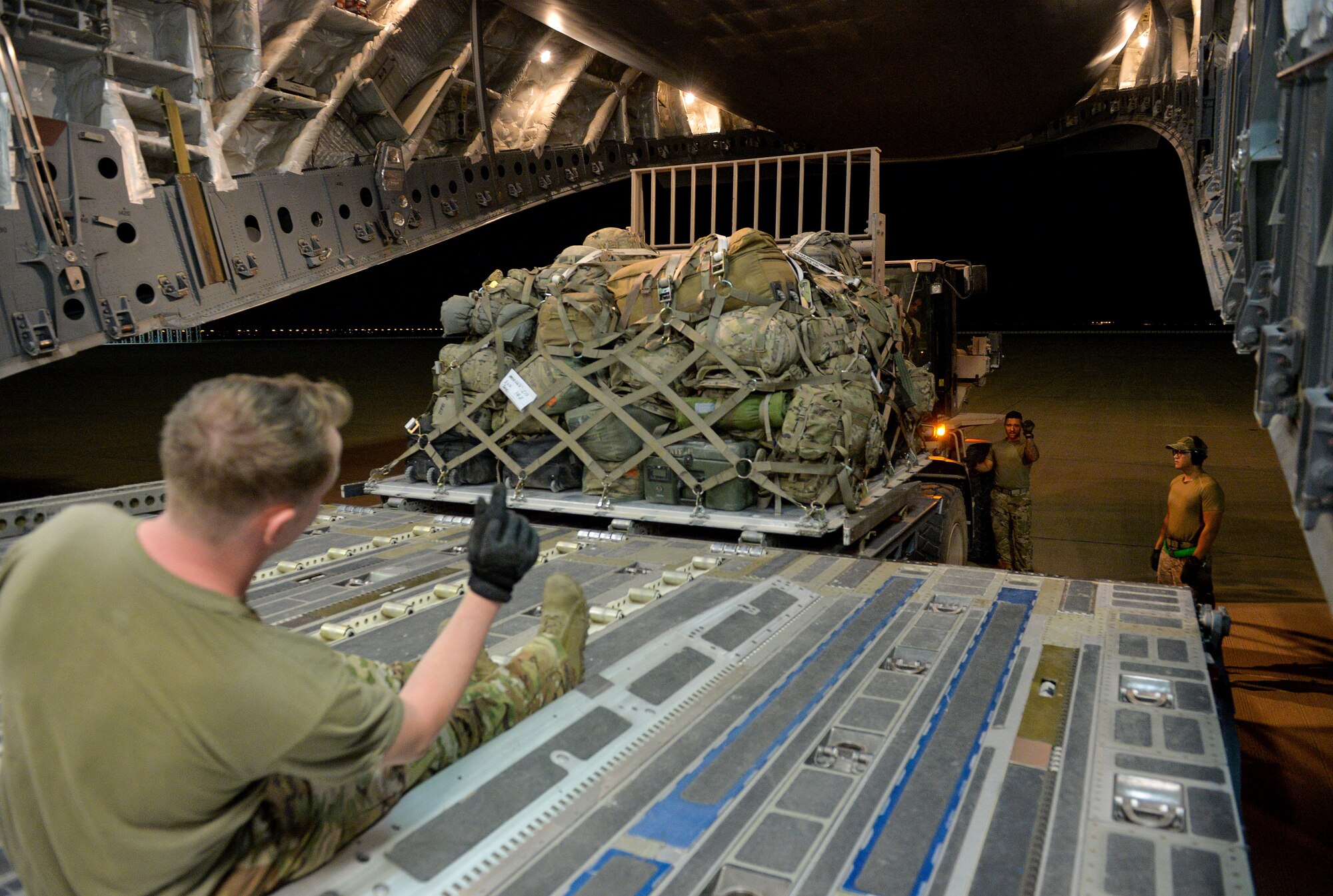 U.S. Air Force Aerial Transportation Specialists with the 378th Aerial Expeditionary Squadron, unload cargo from the back of a C-17 Globemaster III arriving at Prince Sultan Air Base (PSAB), Kingdom of Saudi Arabia (KSA), October  23, 2109.