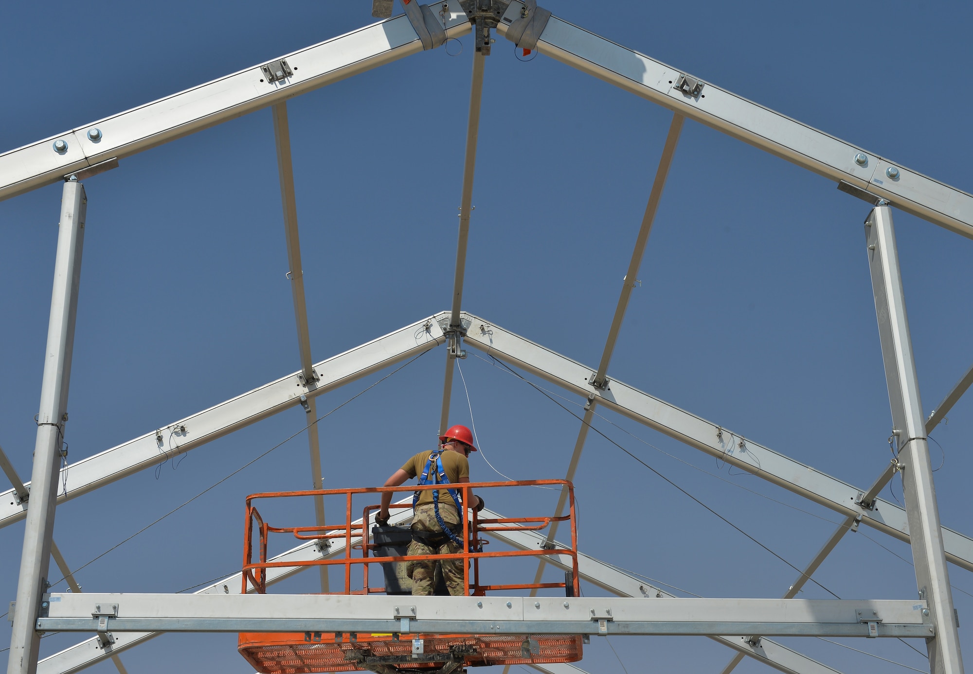 U.S. Air Force Airman 1st Class Tyler Tharpe with the 378th Expeditionary Civil Engineering Squadron, attaches arches to a 6,500 square foot structural dome October 18, 2019, at Prince Sultan Air Base (PSAB), Kingdom of Saudi Arabia (KSA).