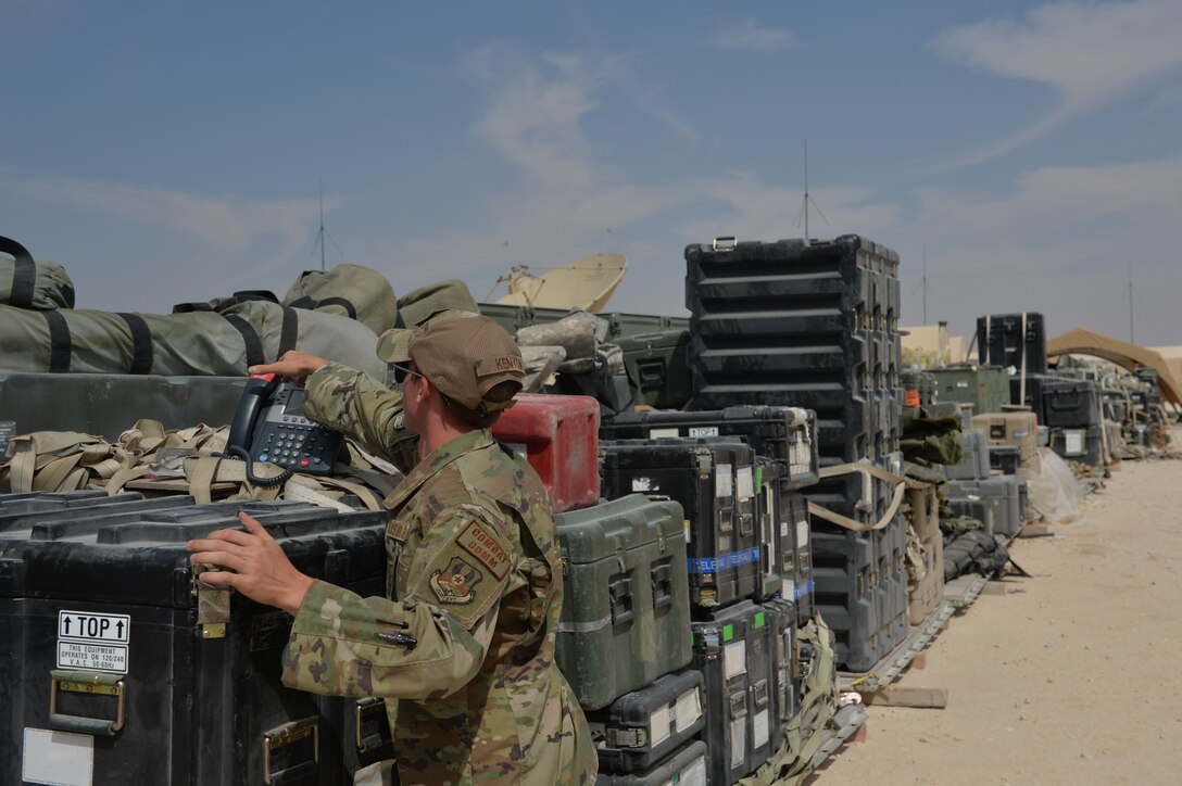 U.S. Air Force Airman 1st Class Tyler Kenyon, 5th Combat Communications, Cyber Transport Technician, grabs communication equipment, at Prince Sultan Air Base (PSAB), Kingdom of Saudi Arabia (KSA), October 17, 2019.