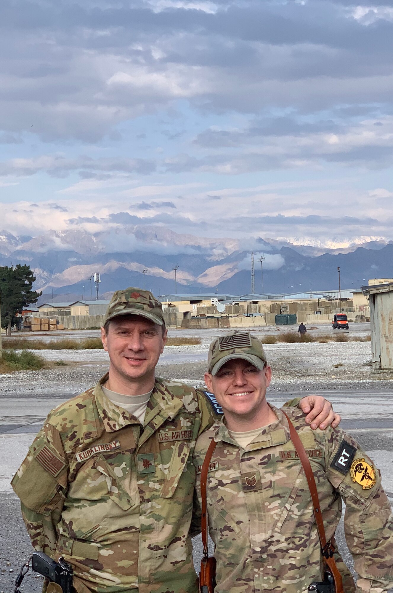 U.S. Air Force Maj. Andrew Kurklinsky, Critical Care Air Transport Team physician and officer in charge, and U.S. Air Force Tech. Sgt. Brian Schneider, CCATT respiratory therapist, pose for a photo during their six-month deployment to Bagram Airfield, Afghanistan.