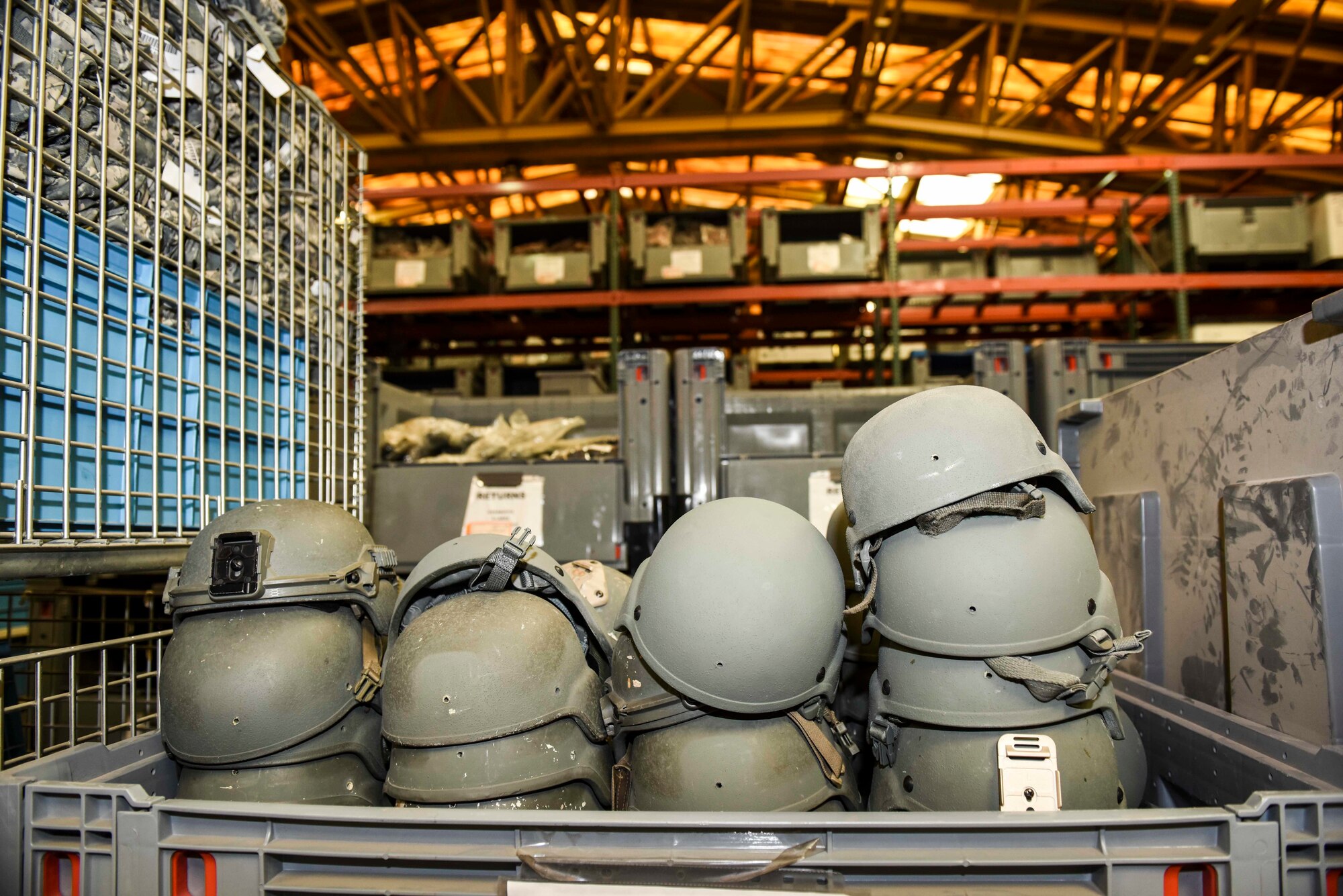 Helmets lie stacked in a pile at the base supply warehouse Nov. 18, 2019, at Incirlik Air Base, Turkey. Airmen involved in operations, both for installation defense and combat-related missions, rely on logistics to ensure they have ample supplies to perform their duties. (U.S. Air Force photo by Staff Sgt. Joshua Magbanua)