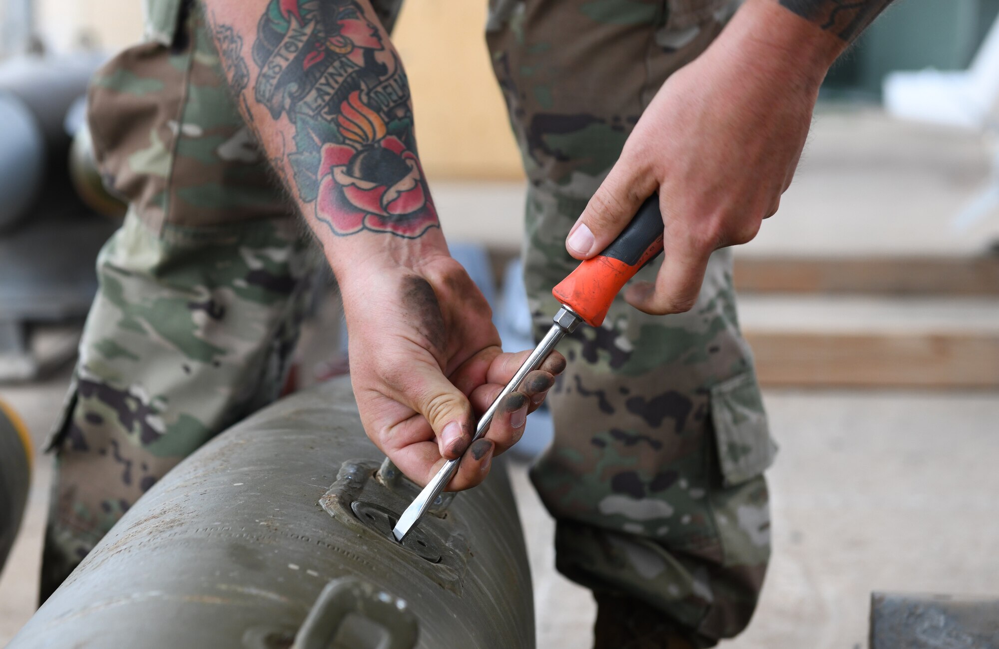 U.S. Air Force Tech. Sgt. Brandon Coleman, 726th Expeditionary Air Base Squadron senior munitions inspector, prepares munitions for assembly during a bomb build at Chabelley Airfield, Djibouti, Nov. 12, 2019. The 726th EABS Munitions Systems Airmen build, inspect and store all munitions at the airfield, ensuring mission effectiveness at a moment’s notice. (U.S. Air Force photo by Staff Sgt. Alex Fox Echols III)