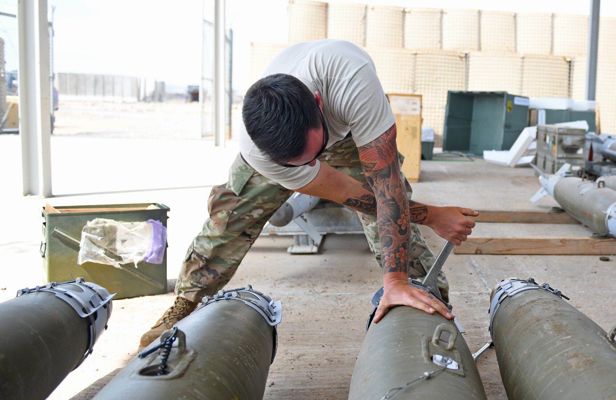 U.S. Air Force Tech. Sgt. Brandon Coleman, 726th Expeditionary Air Base Squadron senior munitions inspector, assembles the nose of munitions during a bomb build at Chabelley Airfield, Djibouti, Nov. 12, 2019. The 726th EABS Munitions Systems Airmen build, inspect and store all munitions at the airfield, ensuring mission effectiveness at a moment’s notice. (U.S. Air Force photo by Staff Sgt. Alex Fox Echols III)