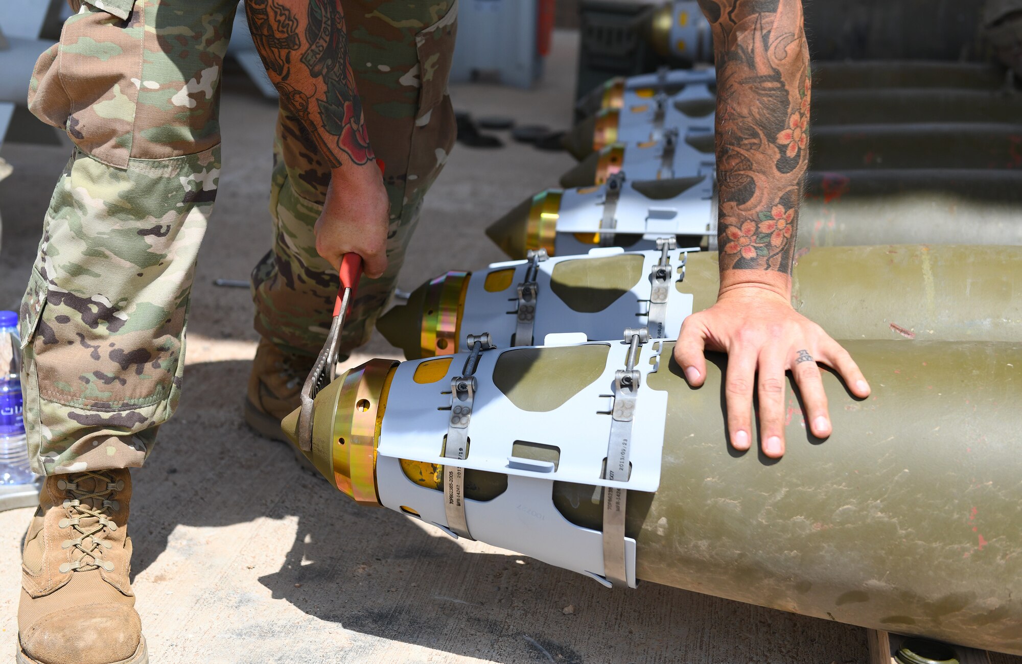 U.S. Air Force Tech. Sgt. Brandon Coleman, 726th Expeditionary Air Base Squadron senior munitions inspector, assembles the nose of munitions during a bomb build at Chabelley Airfield, Djibouti, Nov. 12, 2019. The 726th EABS Munitions Systems Airmen build, inspect and store all munitions at the airfield, ensuring mission effectiveness at a moment’s notice. (U.S. Air Force photo by Staff Sgt. Alex Fox Echols III)