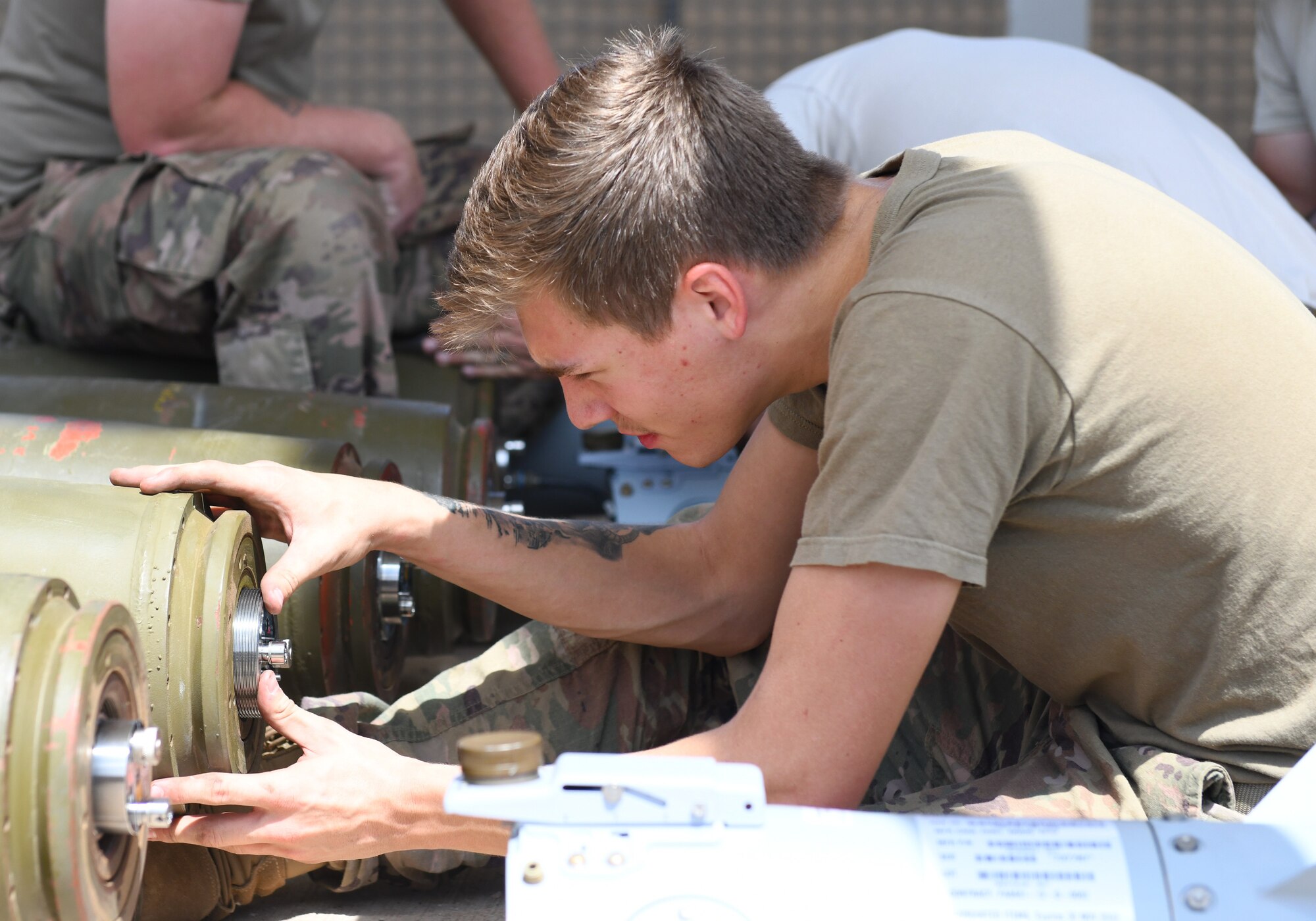 U.S. Air Force Airman 1st Class Noah Keene, 726th Expeditionary Air Base Squadron munitions crew chief, installs a fuse assembly during a bomb build at Chabelley Airfield, Djibouti, Nov. 12, 2019. The 726th EABS Munitions Systems Airmen build, inspect and store all munitions at the airfield, ensuring mission effectiveness at a moment’s notice. (U.S. Air Force photo by Staff Sgt. Alex Fox Echols III)