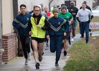 Paul Landrey, center, Massachusetts Institute of Technology Lincoln Laboratory engineer, Matthew Barbosa, left, University of Massachusetts Lowell Air Force ROTC cadet, Lt. Col. Jesse Jaramillo, right, Command, Control, Communications, Intelligence and Networks Directorate program manager, and others participate in a 5K fun run at Hanscom Air Force Base, Mass., Nov. 20. Barbosa was the overall male winner and Rachel Paepke, Air Force Cost Analysis Agency operations research analyst, was the overall female winner. (U.S. Air Force photo by Jerry Saslav)