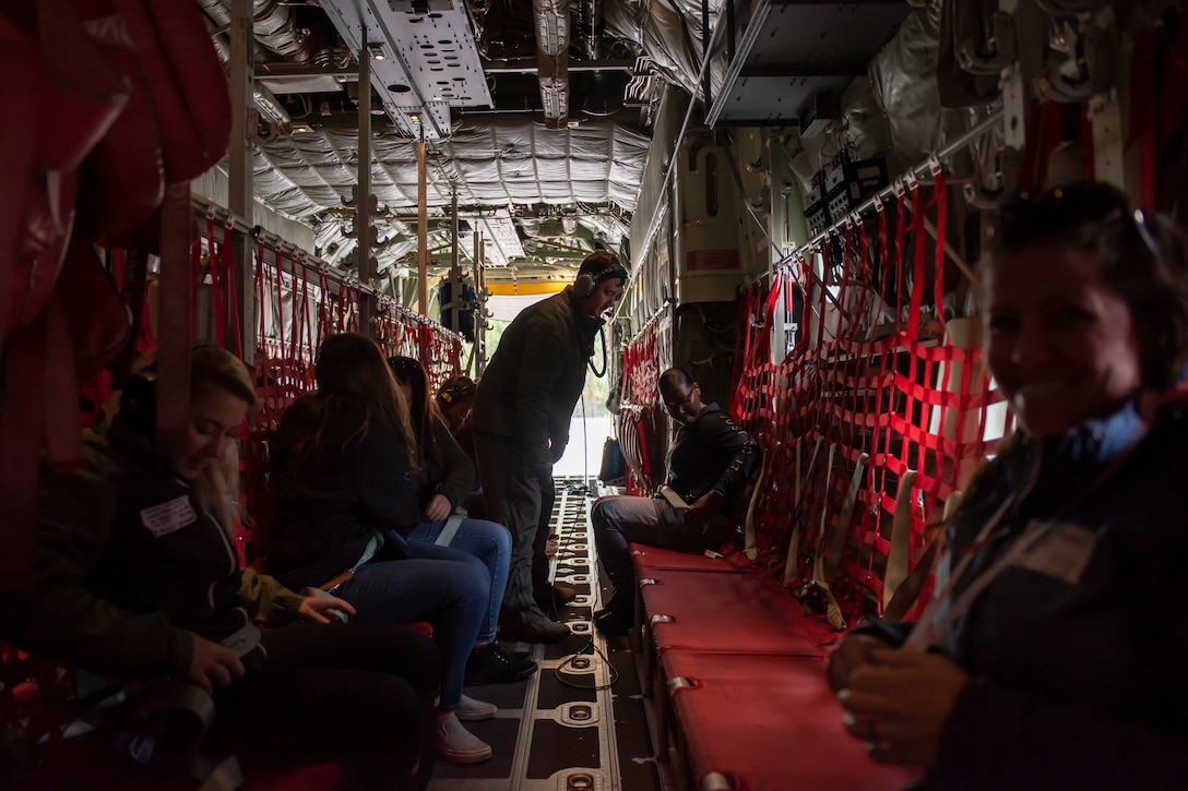 A photo of attendees of the 347th Rescue Group spouses flight preparing for takeoff in an HC-130J Combat King II