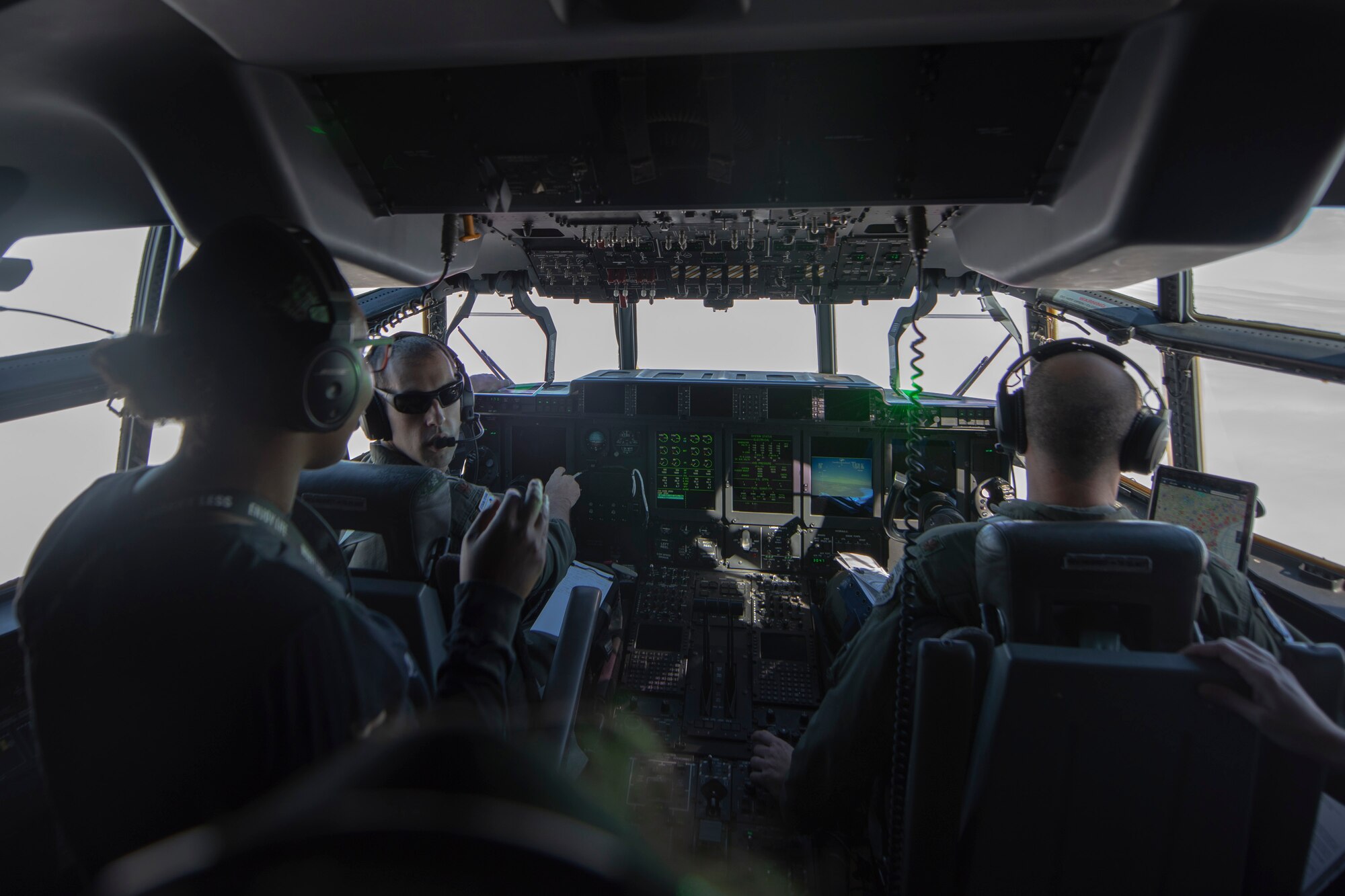 A photo of a pilot talking to attendees of the 347th Rescue Group spouses flight