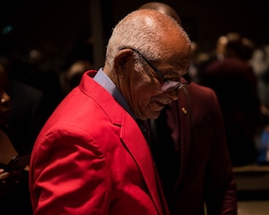 U.S. Army Air Forces Sgt. Thomas Newton, newly inducted Documented Original Tuskegee Airman, grabs some refreshments after his recognition ceremony in Hampton, Virginia, Nov. 13, 2019. During World War II, Newton served as a supply clerk with the 99th Fighter Squadron.  (U.S. Air Force photo by Airman 1st Class Marcus M. Bullock)