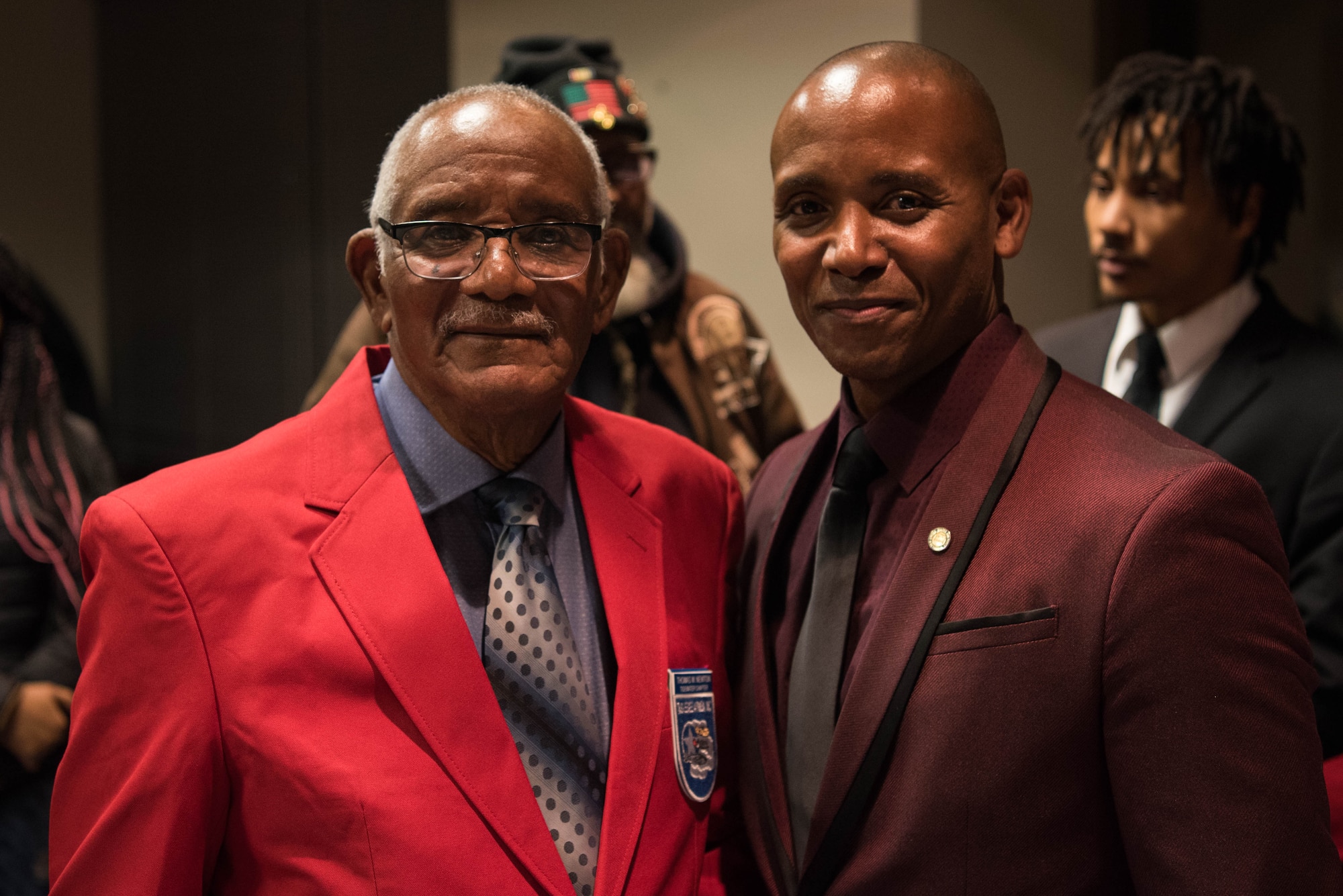 U.S. Army Air Forces Sgt. Thomas Newton (left), poses with his son Retired U.S. Air Force Tech Sgt. Stevie Carmack, after Newton’s recognition ceremony in Hampton, Virginia, Nov. 13, 2019.  After Carmack gathered up the necessary paperwork, he contacted Dr. Bill Burrell, president of the Tidewater Chapter of the Tuskegee Airmen, to help Newton become a certified Documented Original Tuskegee Airman. (U.S. Air Force photo by Airman 1st Class Marcus M. Bullock)