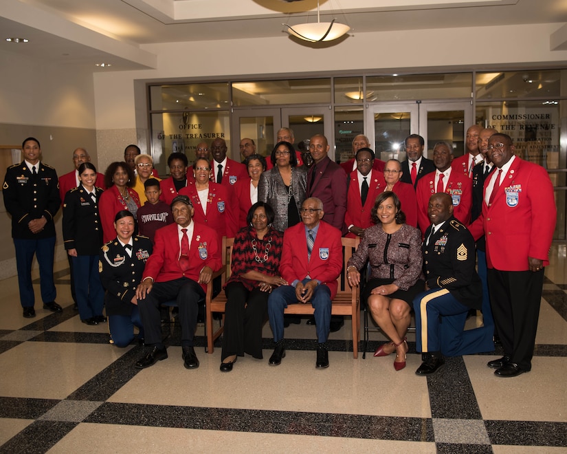 Attendees of the Documented Original Tuskegee Airmen recognition ceremony pose for a group photo in Hampton, Virginia, Nov. 13, 2019. Local community leaders as well as members from the U.S. Air Force and Army were in attendance to pay their respects to the newly indoctrinated DOTA. (U.S. Air Force photo by Airman 1st Class Marcus M. Bullock)