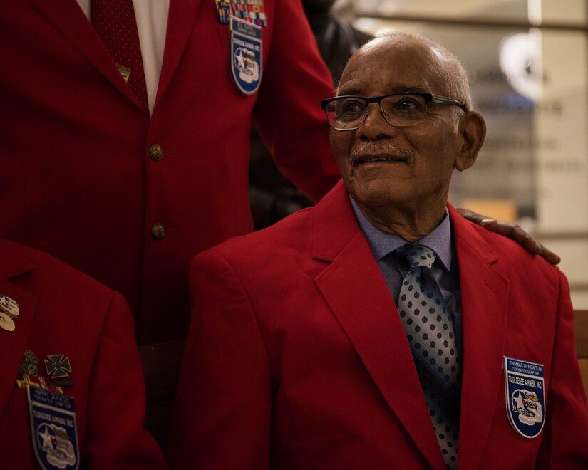 U.S. Army Air Force Sgt. Thomas Newton sits with members from the Tidewater Chapter of the Tuskegee Airmen following a recognition ceremony in Hampton, Virginia, Nov. 13, 2019. Newton was officially recognized as a Documented Original Tuskegee Airman for his service with the 99th Fighter Squadron during World War II. (U.S. Air Force photo by Airman 1st Class Marcus M. Bullock)