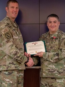 Maj. Javier Lopez, Alaska National Guard staff judge advocate, received a Bronze Star medal Nov. 19, 2019, on Joint Base Elmendorf-Richardson, Alaska, for his service in Operation Enduring Freedom from May 2012 to April 2013. The award was presented to Lopez by Brig. Gen. Charles Lee Knowles, commander of the Alaska Army National Guard.