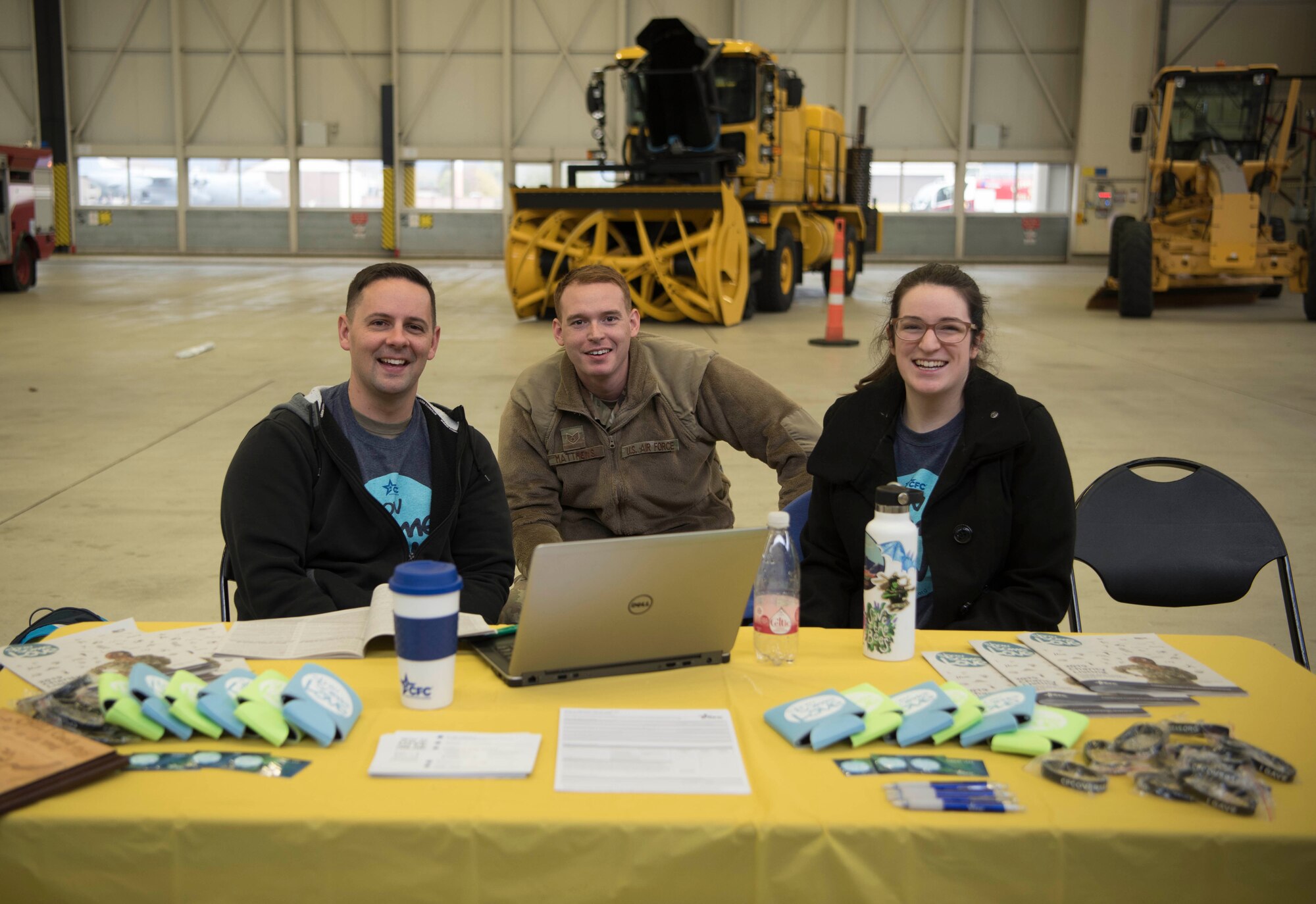 Combined Federal Campaign-Overseas volunteers pose for a photo during the first CFC-O charity event in Europe on Ramstein Air Base, Germany, Nov. 15, 2019. The information booth they ran during the event showcased the vast number of charities offered within the CFC-O, including what percentage per dollar goes to the charitable cause. (U.S. Air Force photo by Senior Airman Kristof J. Rixmann)