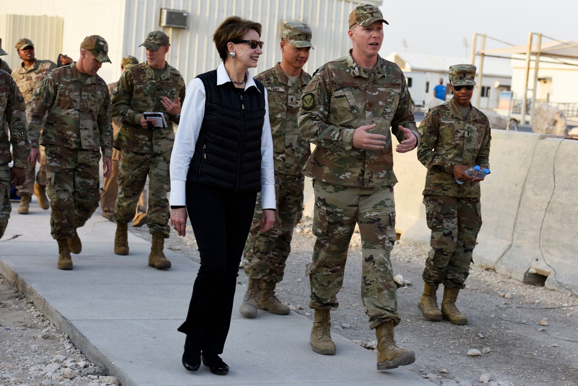 Secretary of the Air Force Barbara Barrett speaks with Maj. Logan Jergens, 379th Expeditionary Force Support Squadron, during a walking tour at Al Udeid Air Base, Qatar on Nov. 17, 2019. During their first overseas trip, Barrett and Air Force Chief of Staff Gen. David L. Goldfein met with AUAB and Qatari leadership, held an all-call where they spoke to readiness, lethality and the future of the U.S. Air Force and visited Airmen and the facilities where they work and live. (U.S. Air Force photo by Tech. Sgt. Ian Dean)
