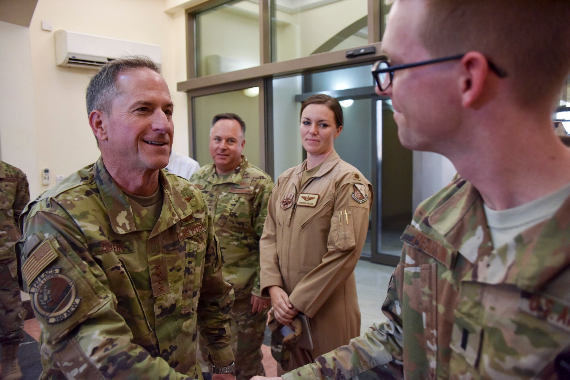 Air Force Chief of Staff Gen. David L. Goldfein speaks with an Airman after arriving at Al Udeid Air Base, Qatar on Nov. 17, 2019. During their first overseas trip, Secretary of the Air Force Barbara Barrett and Goldfein met with AUAB and Qatari leadership, held an all-call where they spoke to readiness, lethality and the future of the U.S. Air Force and visited Airmen and the facilities where they work and live. (U.S. Air Force photo by Tech. Sgt. John Wilkes)
