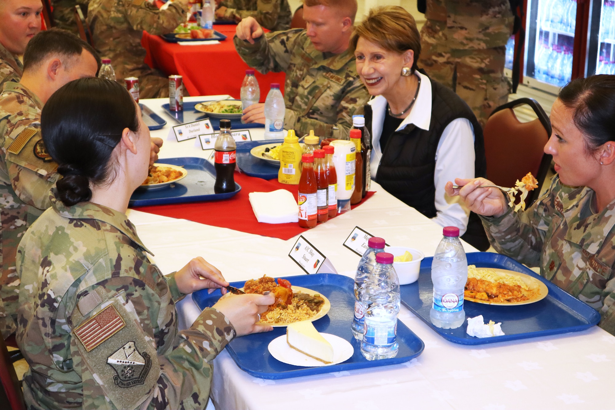 Secretary of the Air Force Barbara Barrett speaks with airmen who are deployed for the first time during a dinner at Blatchford-Preston Complex dinning facility at Al Udeid Air Base, Qatar on Nov. 17, 2019. During their first overseas trip, Barrett and Air Force Chief of Staff Gen. David L. Goldfein met with AUAB and Qatari leadership, held an all-call where they spoke to readiness, lethality and the future of the U.S. Air Force and visited Airmen and the facilities where they work and live.(U.S. Air Force photo by Tech. Sgt. Ian Dean)