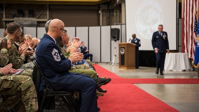 Gen. John W. “Jay” Raymond, U.S. Space Command and Air Force Space Command commander, presents the Combined Force Space Component Command guidon to Maj. Gen. John. E. Shaw, CFSCC and 14th AF commander, during a change of commander ceremony Nov. 20, 2019, at Vandenberg Air Force Base, Calif. The CFSCC mission is to plan, integrate, conduct, and assess global space operations in order to deliver combat relevant space capabilities to Combatant Commanders, Coalition partners, the Joint Force, and the Nation. (U.S. Air Force photo by Airman 1st Class Aubree Milks)
