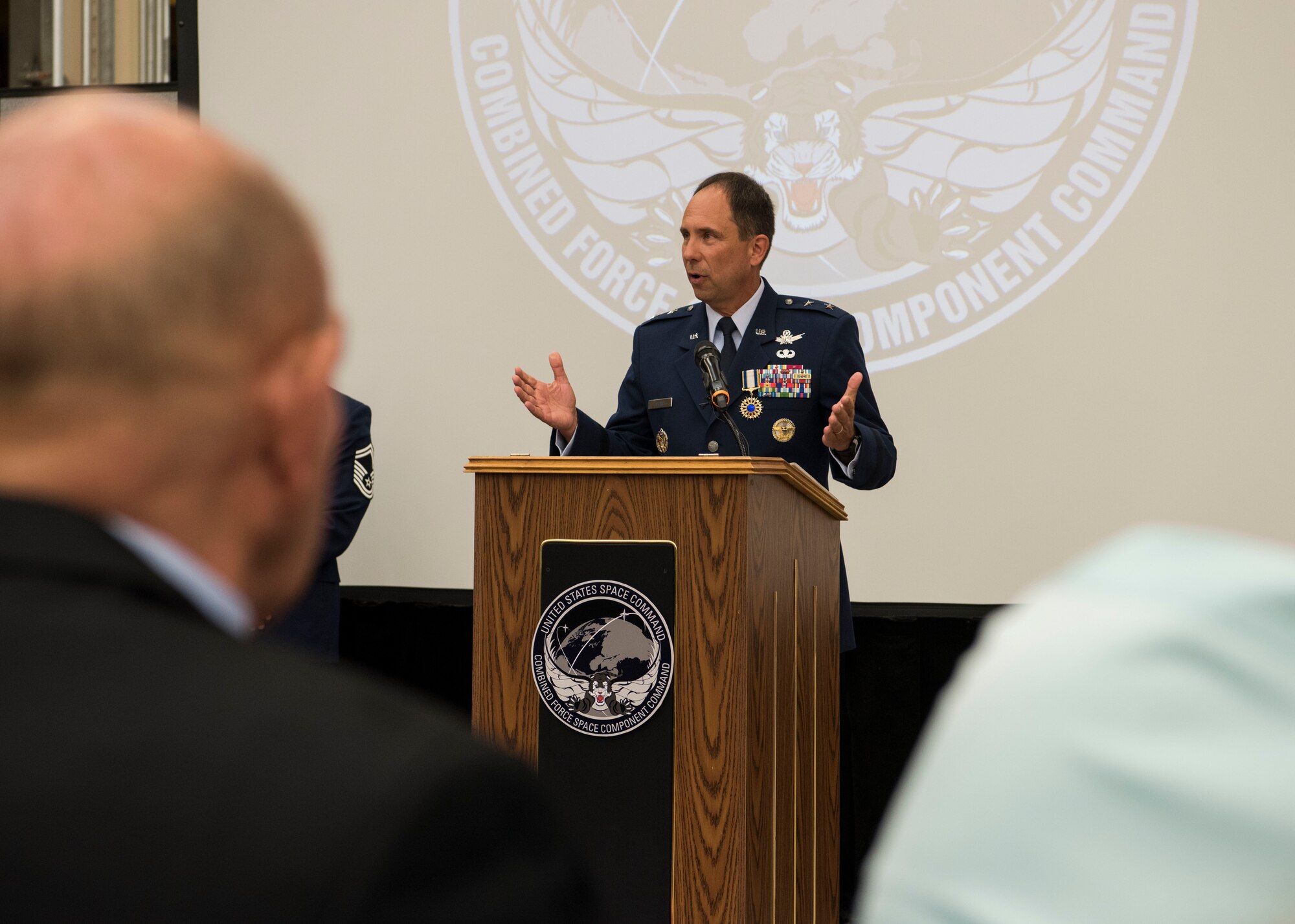 Maj. Gen. John E. Shaw, Combined Force Space Component Command and 14th Air Force commander, speaks during the CFSCC and 14th AF change of commander ceremony Nov. 20, 2019, at Vandenberg Air Force Base, Calif. As the new commander of the CFSCC, Shaw oversees the planning and execution of space operations through four distinct and geographically dispersed operations centers, including: Combined Space Operations Center at Vandenberg AFB, Calif; Missile Warning Center at Cheyenne Mountain Air Force Station, Colo; Joint Overhead Persistent Infrared Planning Center at Buckley AFB, Colo; and Joint Navigation Warfare Center located at Kirtland AFB, N.M. (U.S. Air Force photo by Airman 1st Class Aubree Milks)