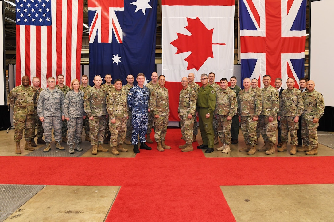 Senior space officials from Australia, Canada, the United Kingdom, and the United States pose for a photo during a Commander's Conference Nov. 20, 2019, at Vandenberg AFB, Calif. U.S. Air Force Maj. Gen. John E. Shaw, Commander, Combined Force Space Component Command and 14th Air Force, hosted the conference immediately following the CFSCC and 14th AF change of command ceremony. During the conference the commanders discussed their respective missions, as well as recent successes and challenges. (U.S. Air Force photo by Major Cody Chiles)