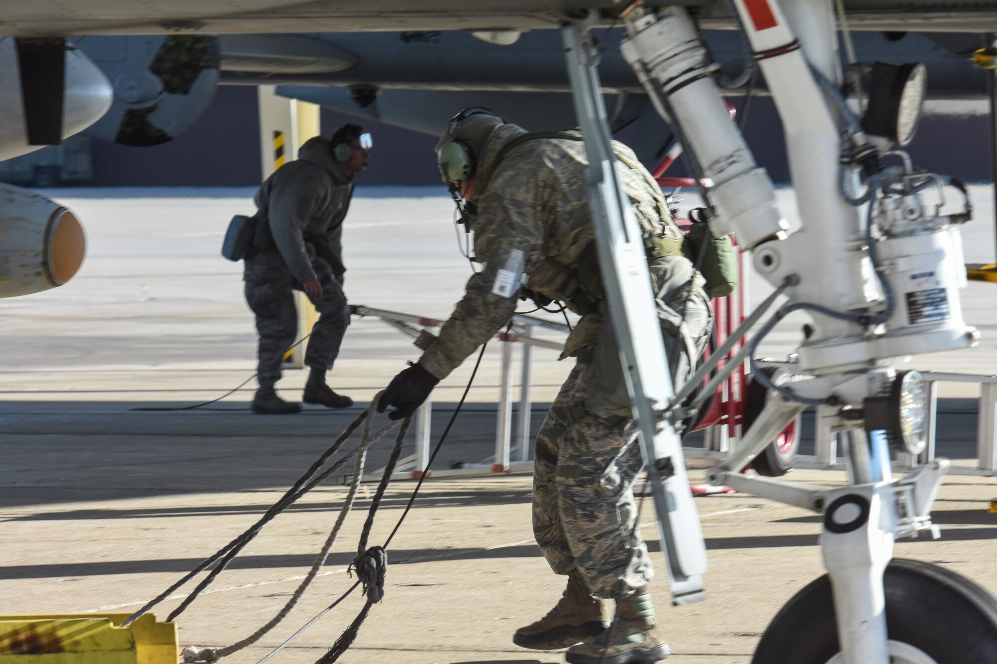 Airman 1st Class Thomas Satterlee, left, and Tech. Sgt. Joshua Hickerson, both crew chiefs with the 442d Maintenance Squadron, prepare the aircraft for takeoff Nov. 3, 2019, at Whiteman Air Force Base, Mo. The pair, along with the 442d Fighter Wing as a whole, are scheduled to participate in a 3-day readiness exercise to validate the wing’s ability to perform mission essential tasks during contingency operations.