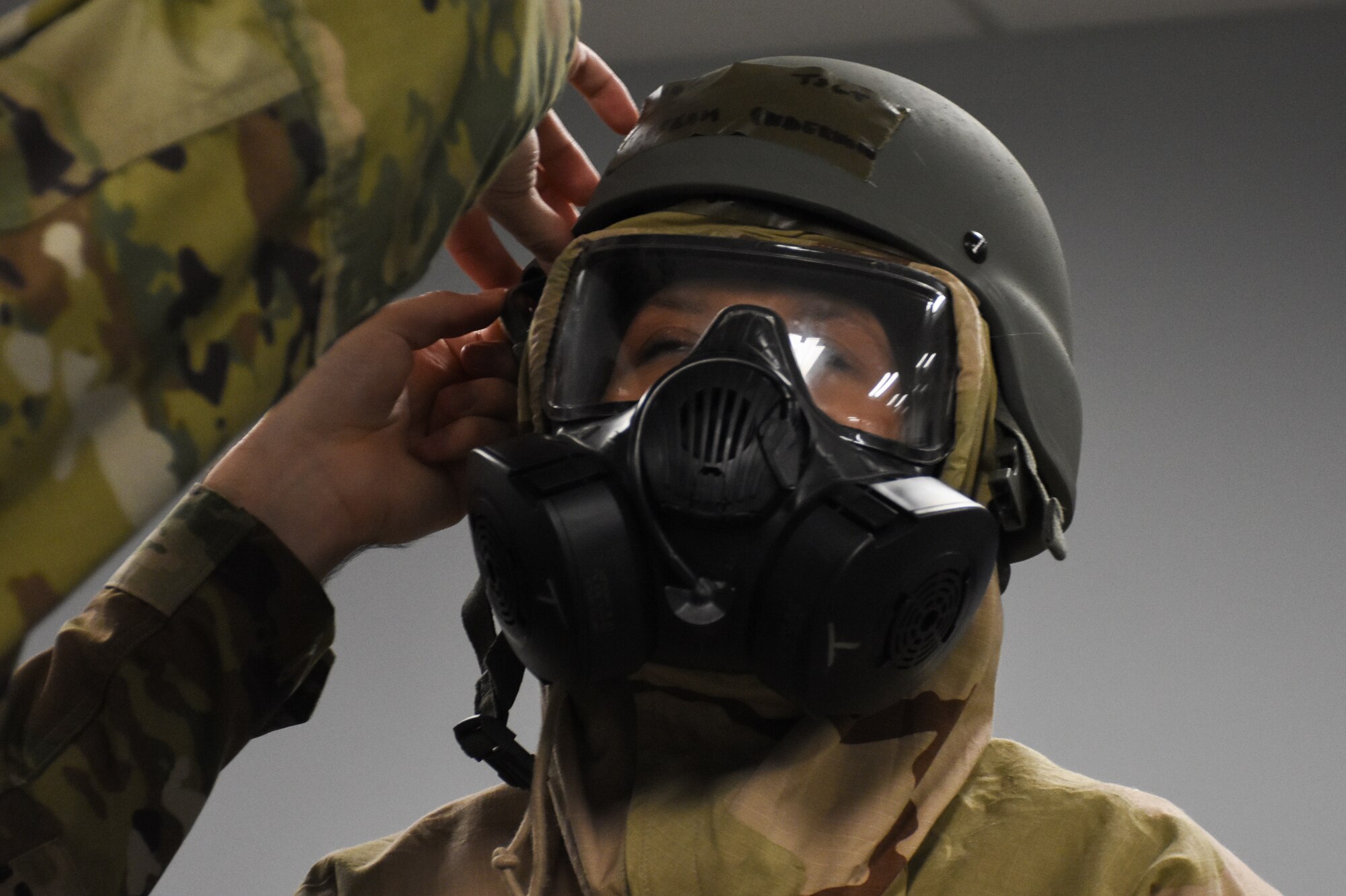 Tech. Sgt. Rebekah Underwood, a knowledge operations technician with the 442d Communications Flight, dons mission-oriented protective posture level 3 during a wing level readiness exercise, Ozark Thunder 20-01, at Whiteman Air Force Base, Mo., Nov. 3, 2019. During the exercise, Airmen participated in chemical warfare training and self-aid buddy care training while also performing their normal job duties to validate the wing’s ability to perform mission essential tasks during contingency operations.