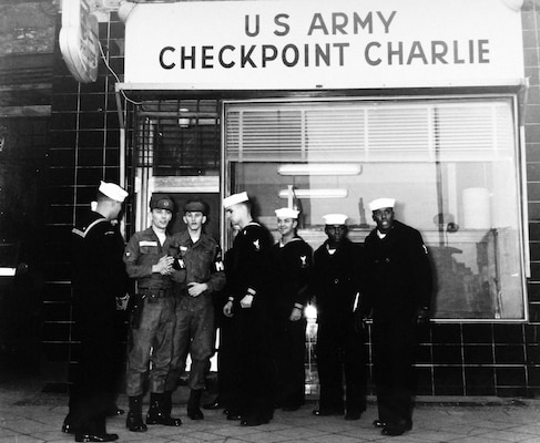 During Berlin Crisis of 1961, group of U.S. Naval Reservists talk to U.S. Army Soldiers who man Checkpoint Charlie, only American checkpoint along Berlin Wall (U.S. Navy Museum)