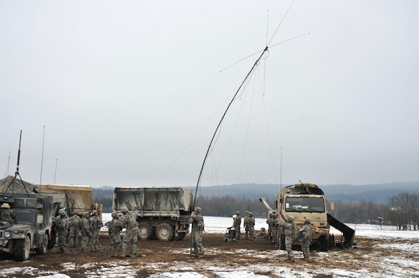 U.S. troopers, assigned to A Battery, Field Artillery Squadron, 2nd Cavalry Regiment, raise assembled radio antenna to enable field communications during Operation Chosin at 7th Army Joint Multinational Training Command’s Grafenwoehr Training Area, Germany, January 28, 2015 (U.S. Army/Gertrud Zach)