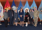 Five women and two men pose in front of flags at the McNamara Headquarters Complex Nov. 20 National American Indian and Alaska Native Heritage Month observance.