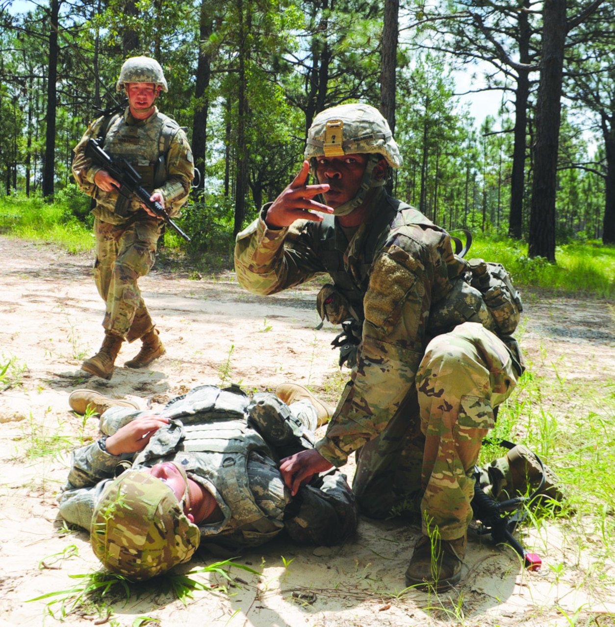 Soldier takes heart rate.