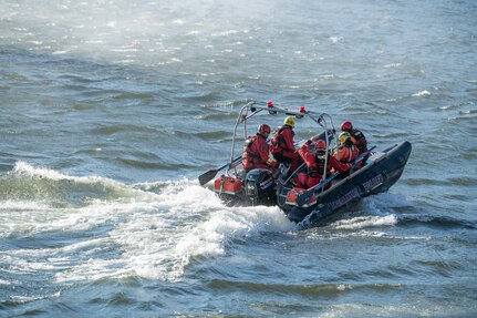 First responders maneuver their boat into rotor wash from a West Virginia Army National Guard UH-60M Blackhawk helicopter assigned to Company C, 1-150th Assault Battalion on the Kanawha River during a joint-agency swift water search-and-rescue exercise led by the WVNG’s Army Interagency Training and Education Center Nov. 15, 2019, in Dunbar, W.Va.