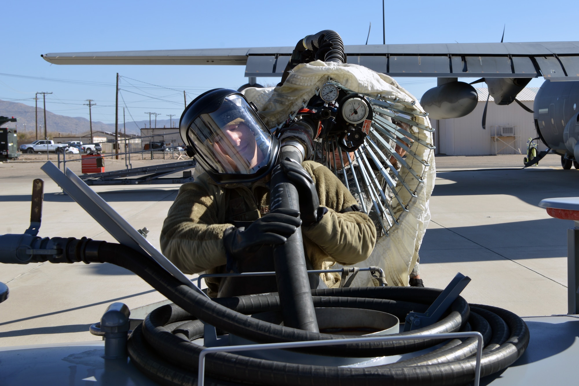 U.S. Air Force Airman 1st Class Jarrett Hoyt, 415th Aircraft Maintenance Unit hydraulics specialist, drains fuel from the inflight refueling pod on a HC-130J Combat King II on the flight line at Kirtland Air Force Base, N.M., Nov. 14, 2019.  The 415 AMU is responsible for all maintenance on the MC-130J Commando II and HC-130J Combat King II aircraft assigned to keep them mission ready for the 415th Special Operation Squadron.