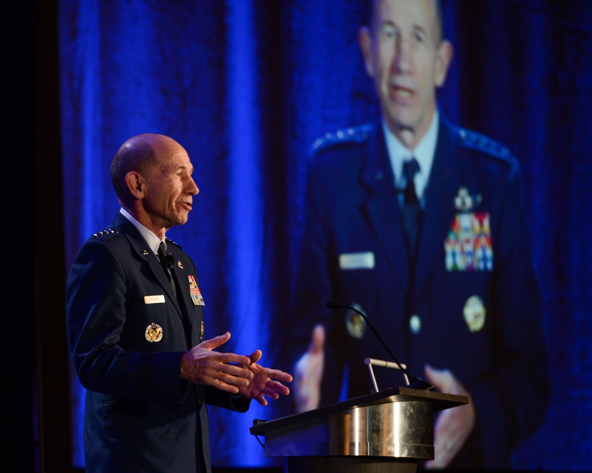 U.S. Air Force Gen. Mike Holmes, commander of Air Combat Command, speaks to Alamo Armed Forces Communication and Engineering Association Chapter Event attendees in San Antonio, Texas, Nov. 20, 2019. During the annual cyber- and technology-focused conference, Holmes discussed the importance of continuously evolving the U.S. military’s multi-domain warfighter to combat tomorrow’s threats. (U.S. Air Force photo by Sharon Singleton)