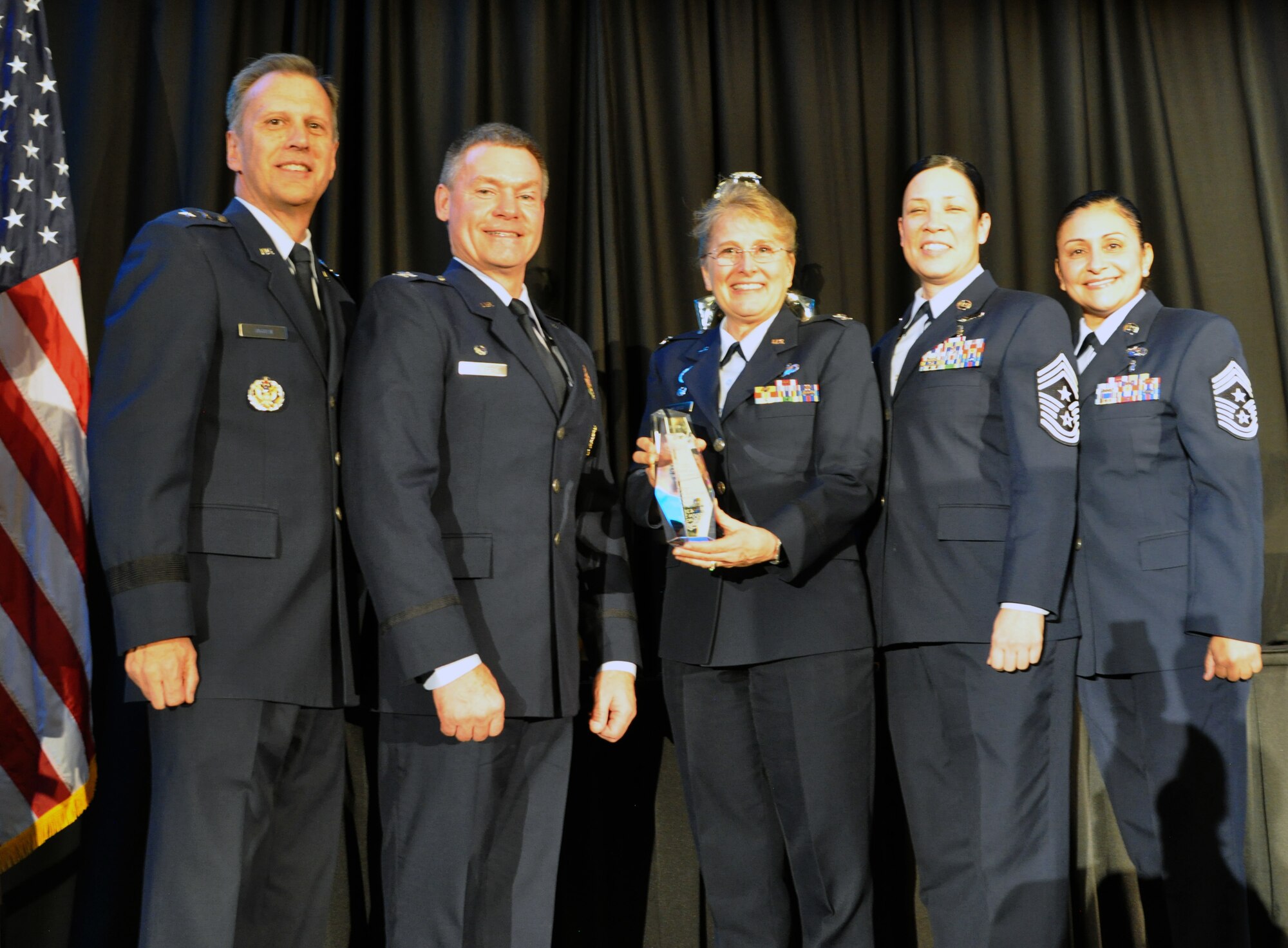 Members from the 439th Airlift Wing, Westover Air Reserve Station, Massachusetts, accept the 2019 Technical Sergeant Anthony C. Campbell, Jr. Trophy for Mission Support Group Excellence on behalf of the 439th Mission Support Group. The 439th MSG was honored for their continued ability to excel above and beyond the call on multiple occasions. This included executing 20 US Secret Service support missions, providing more than 2,000 personnel hours in support of President and Vice President of the United States. In addition, members of the group’s Explosive Ordnance Disposal unit provided more than 130 hours as volunteer firefighters, responding to multiple emergency calls and saving multiple lives. (U.S. Air Force photo by Candy Knight)