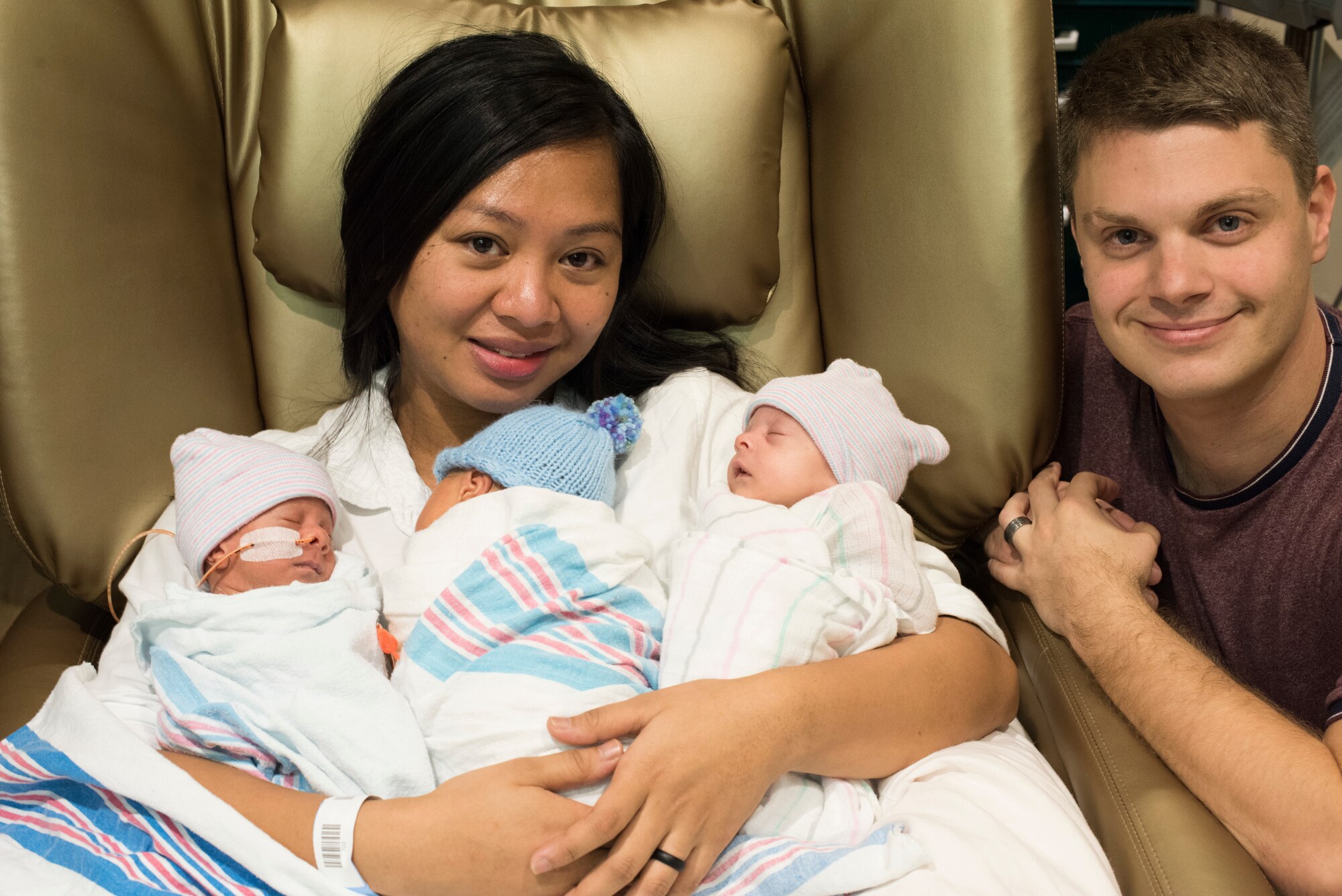 Staff Sgt. Robert Bolton and his wife, Heaven, Bolton with their triplets.