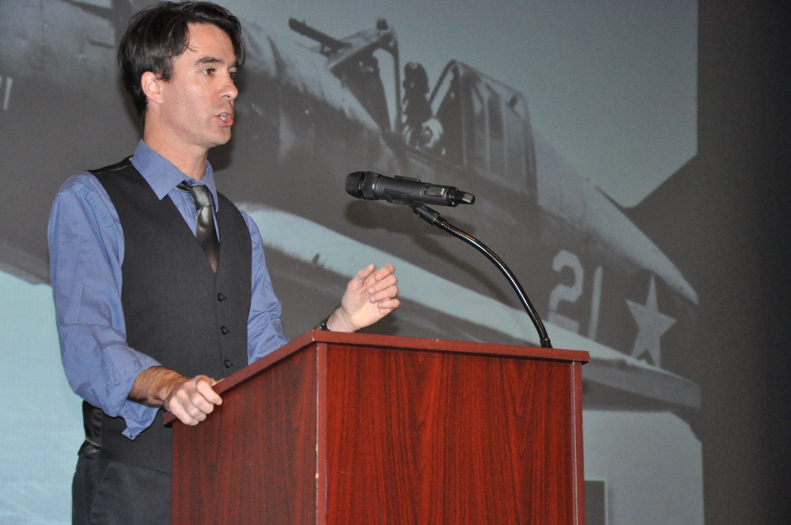 IMAGE: DAHLGREN, Va. (Nov. 15, 2019) - Timothy Orr, an associate professor of military history at Old Dominion University, and co-author of “Never Call Me A Hero:  A Legendary American Dive-Bomber Pilot Remembers the Battle of Midway,” stresses the importance of never forgetting the Battle of Midway warfighters. He shares their stories as a part of the Naval Heritage Command Lecture Series sponsored by the Naval Surface Warfare Center Dahlgren Division Integrated Combat Systems Department Nov. 15 at the base theater. “No matter what they did, whether they came back or died out on the ocean, were wounded, or blew up in their plane – all of that is a story worth telling,” he said. “It explains how the U.S. eventually triumphed over the empire of Japan in the Pacific War. It really shapes the world as we know it today.”