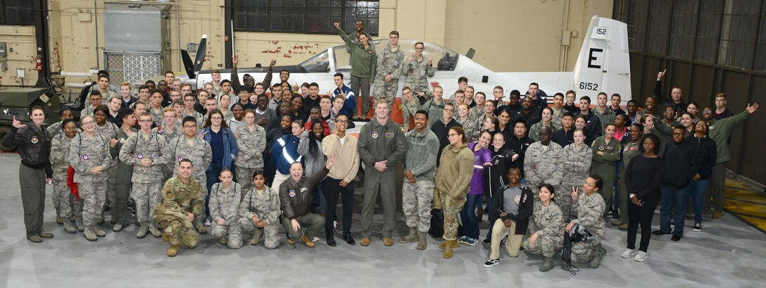 A group of students and their Air Force mentors take a group shot at an Aim High outreach event at Maxwell Air Force Base, Alabama.