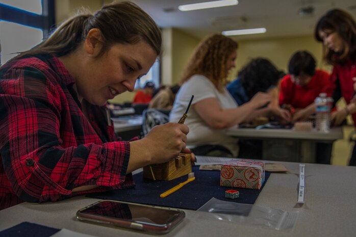 MCAS Iwakuni residents make engraved Tenkoku stamps