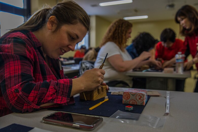 MCAS Iwakuni residents make engraved Tenkoku stamps