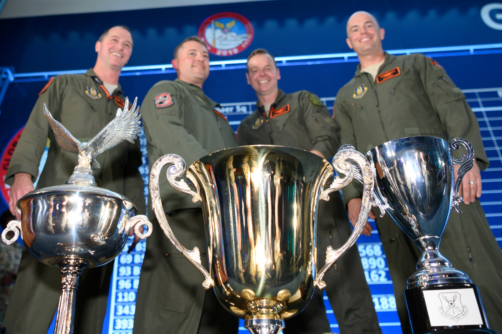Photo of 343rd Bomb Squadron posing with trophies.