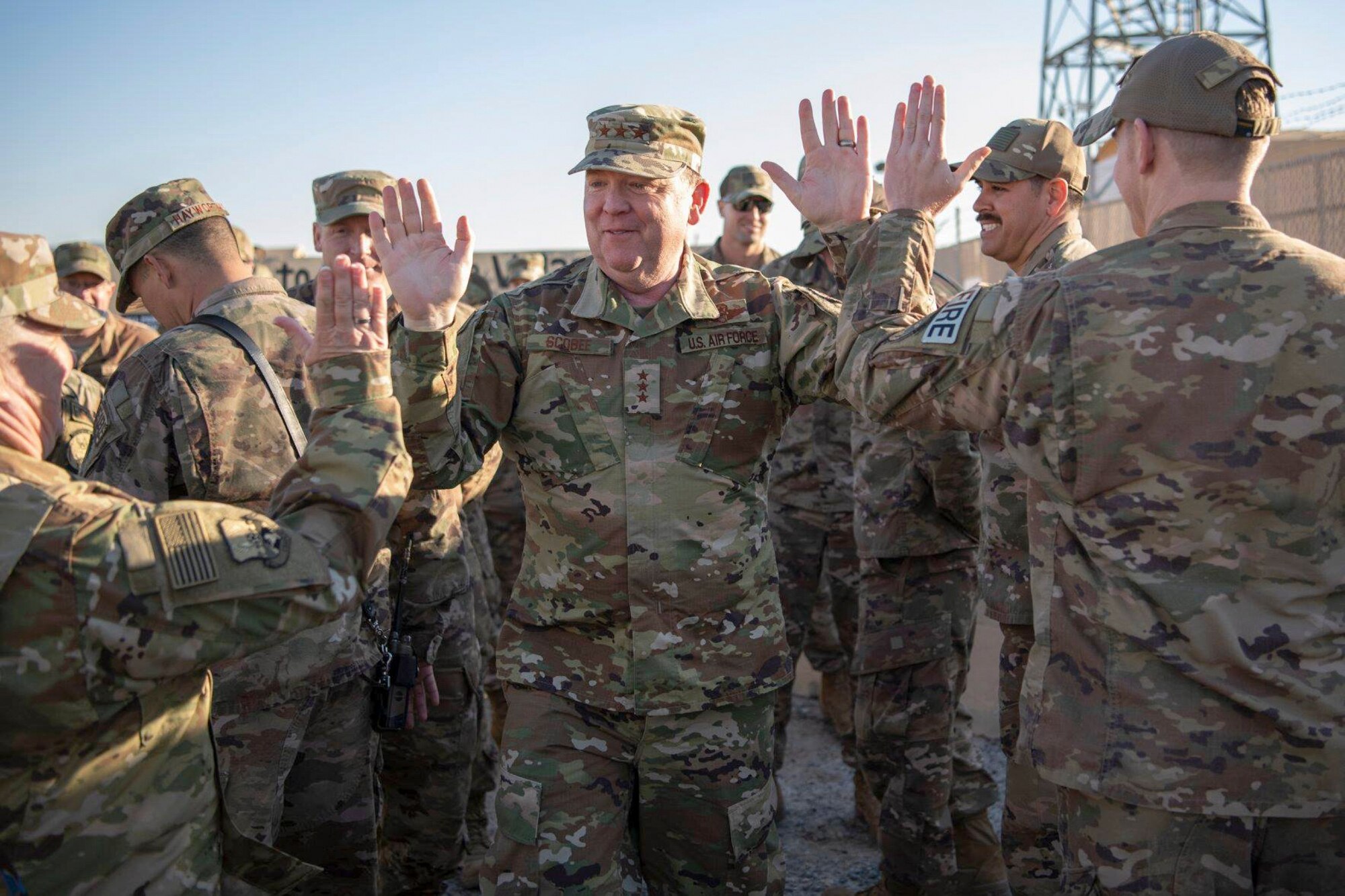 Lt. Gen. Richard Scobee, high-fives deployed members of his Air Force Reserve family. (U.S. Air Force Photo by Tech. Sgt. Robert Cloys)