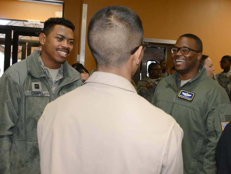 Maj. Boston McClain (far right), who works at the Air Force headquarters at the Pentagon, talks to a couple of students during the Aim High Outreach event at Maxwell Air Force Base, Alabama.