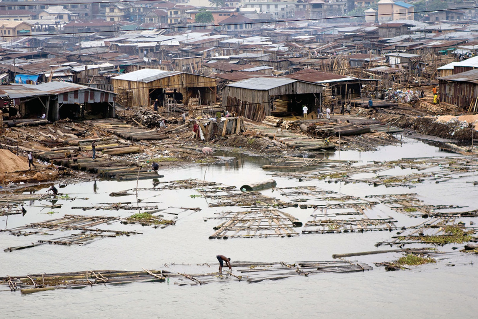 Demographers project that more than 70 percent of world’s population will live in cities, many of them coastal, by 2050, and that potential for instability and strife caused by humanitarian or other disasters in megacities makes it necessary to look at them as potential future battlegrounds, Lagos, Nigeria, June 23, 2011 (Wikipedia)